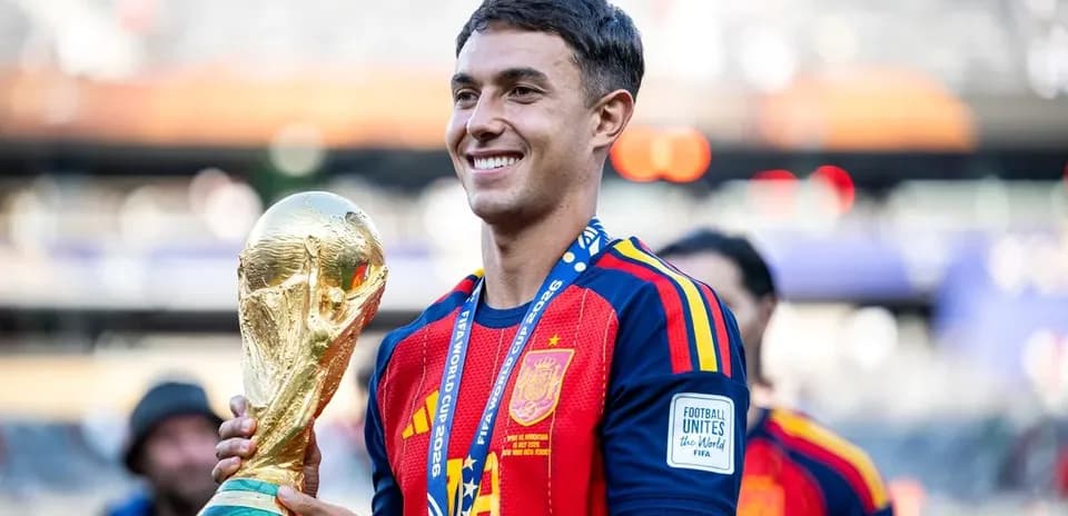 Player celebrating with FIFA World Cup trophy
