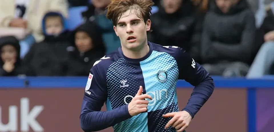 Player in blue kit running during a match
