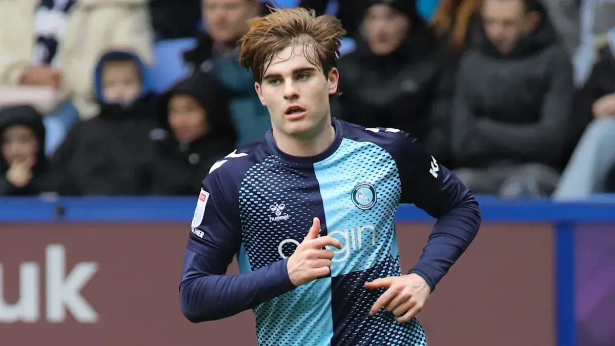 Player in blue kit running during a match