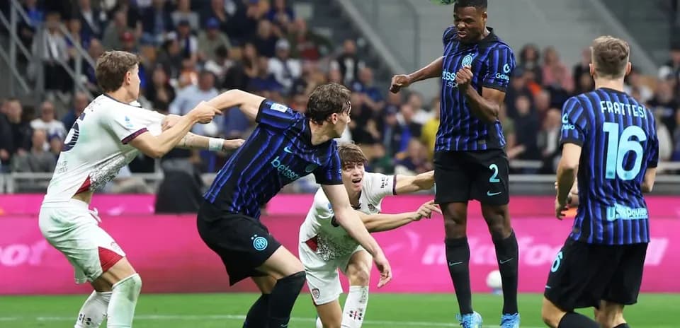 Inter player heading the ball against Cagliari