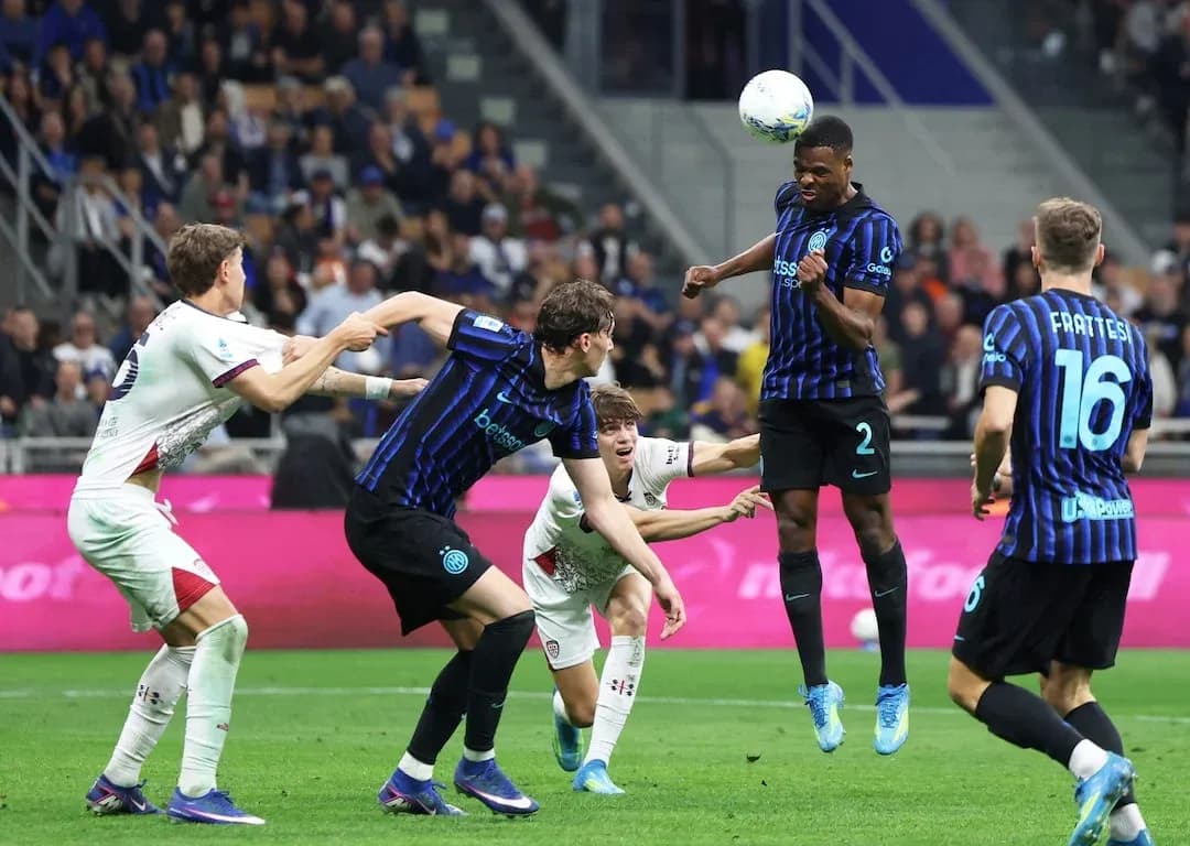 Inter player heading the ball against Cagliari