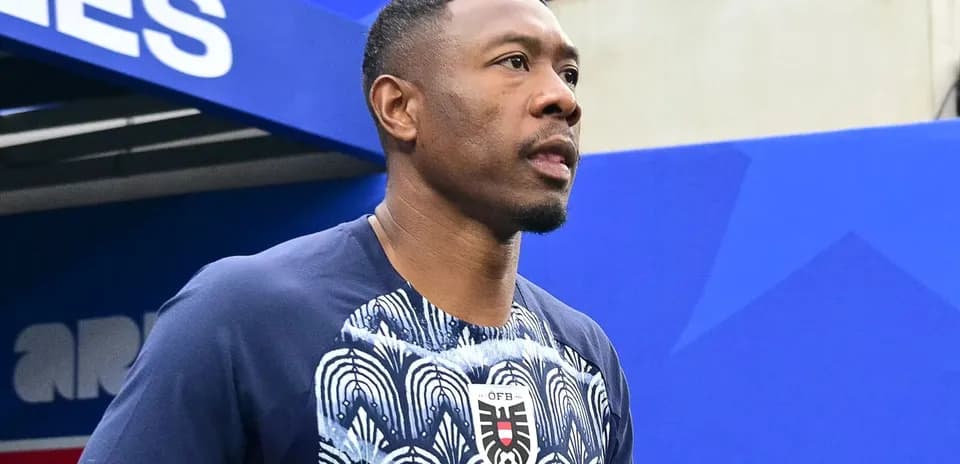 Player entering the field with a soccer ball