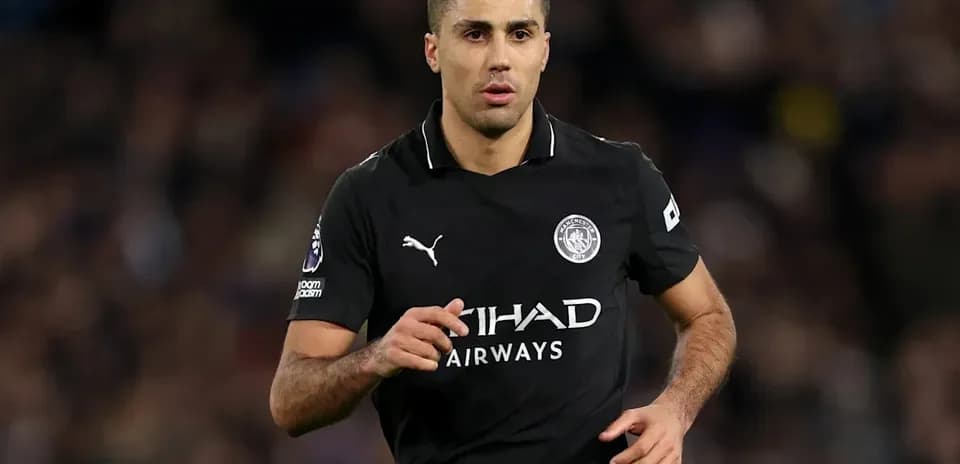Player running in black Manchester City kit