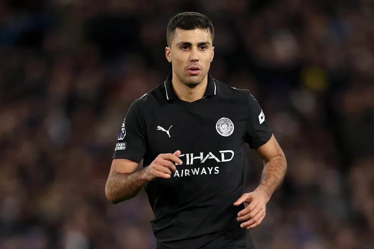 Player running in black Manchester City kit