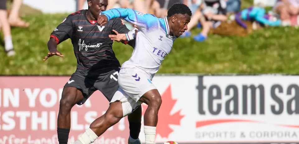 Player from Pacific FC dribbling past defender
