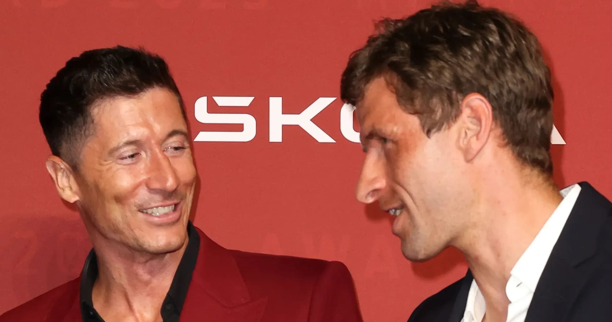 Two men conversing at an award event
