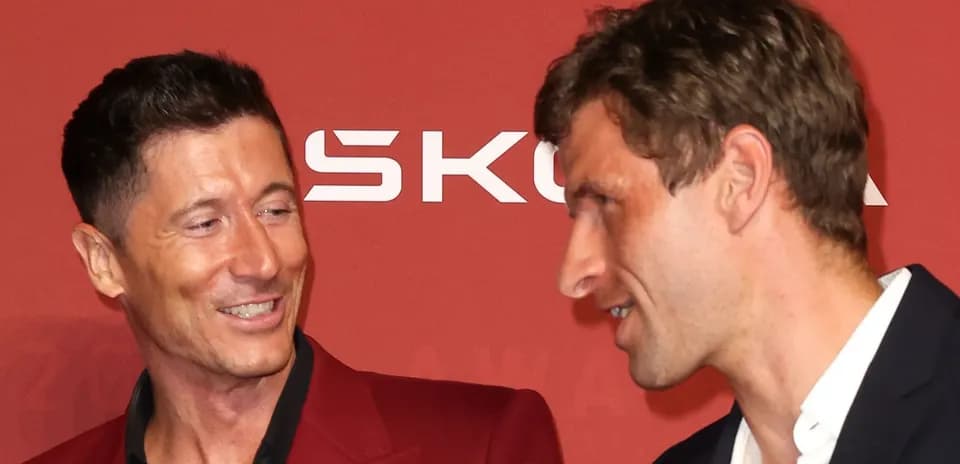 Two men conversing at an award event