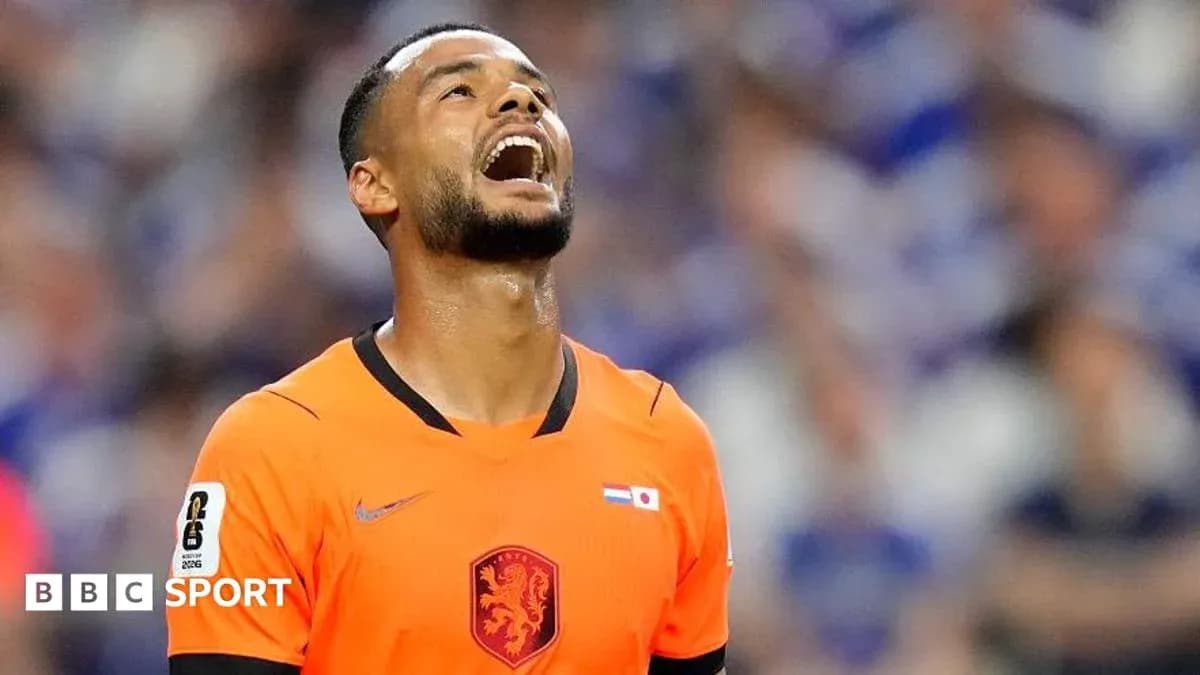 Player in orange jersey reacting during a match