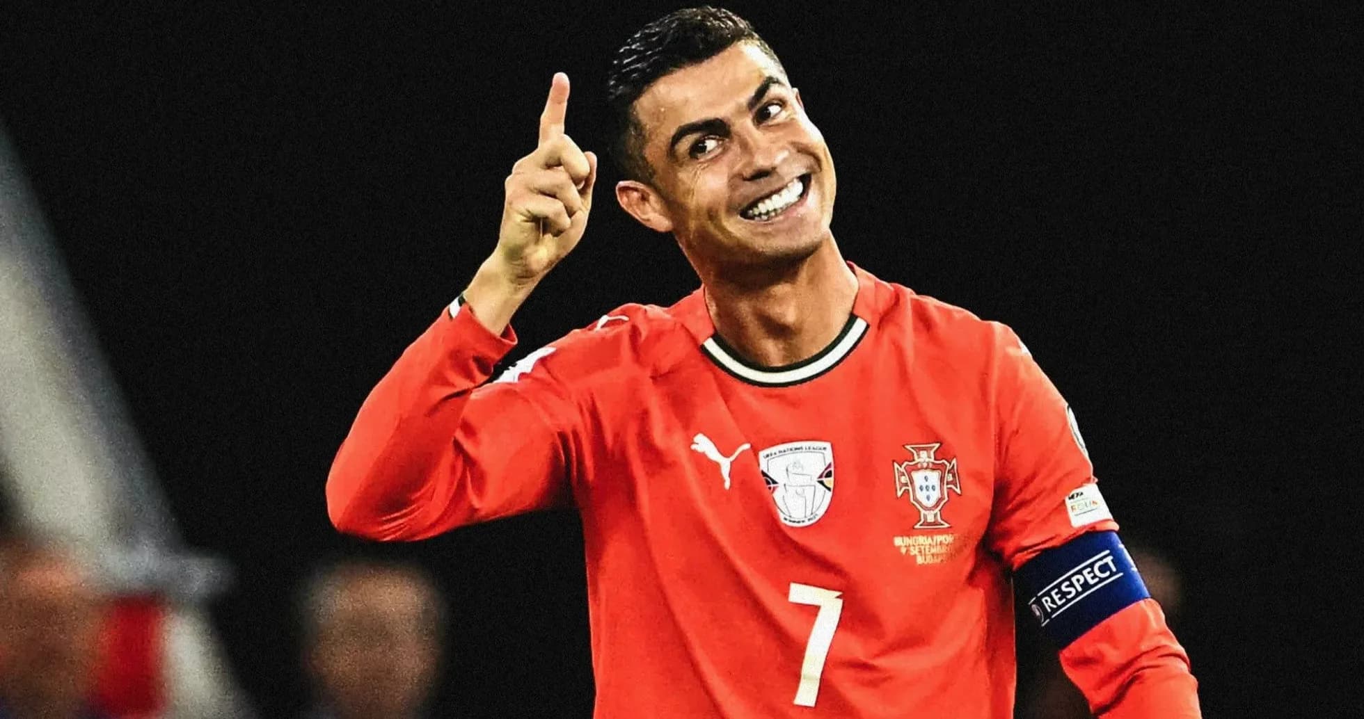 Player celebrating in red jersey during match