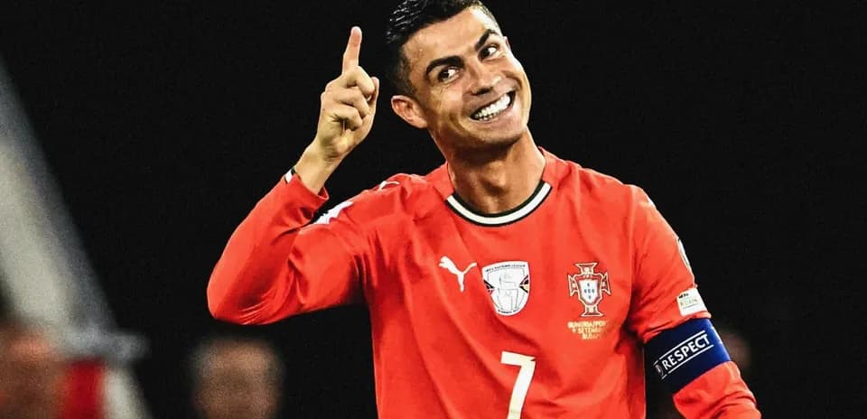 Player celebrating in red jersey during match
