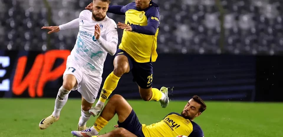 Player evading tackle during intense football match