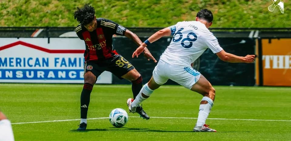 Atlanta United II player challenging New York City II opponent