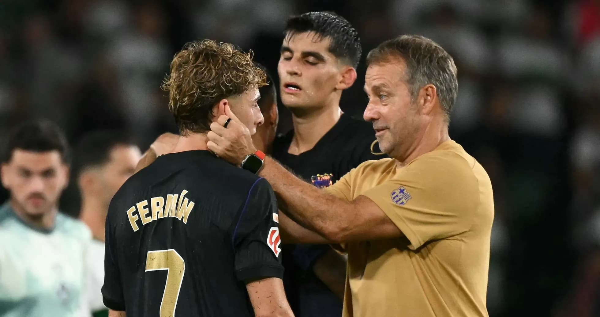 Coach speaking to player Fermín after match