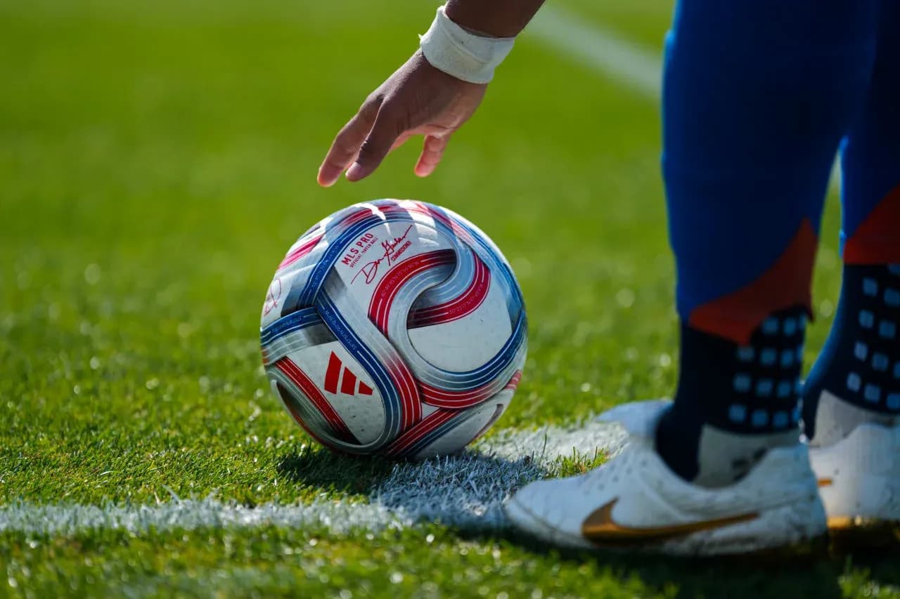 Player preparing to kick a soccer ball