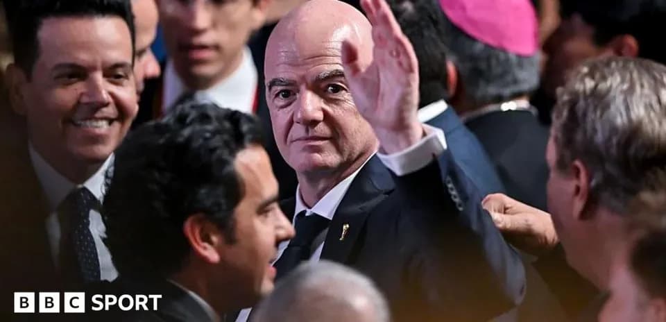 Man waving among a crowd at an event