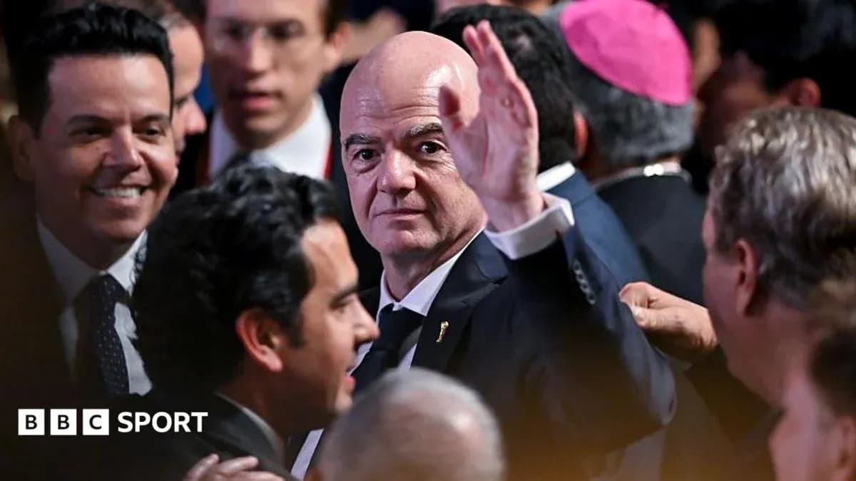 Man waving among a crowd at an event