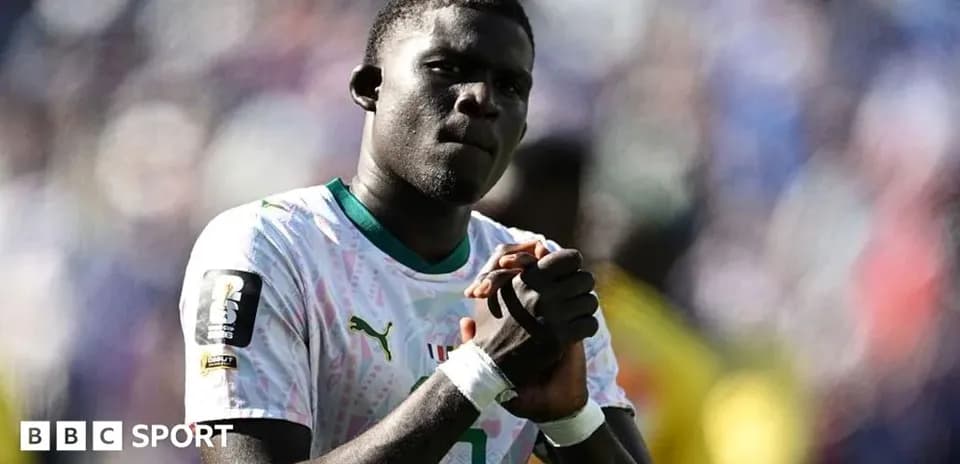 Player clasping hands in front of crowd