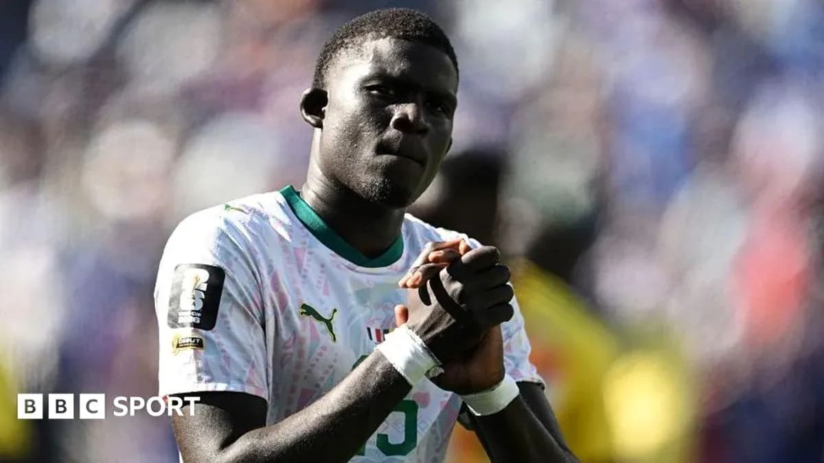 Player clasping hands in front of crowd