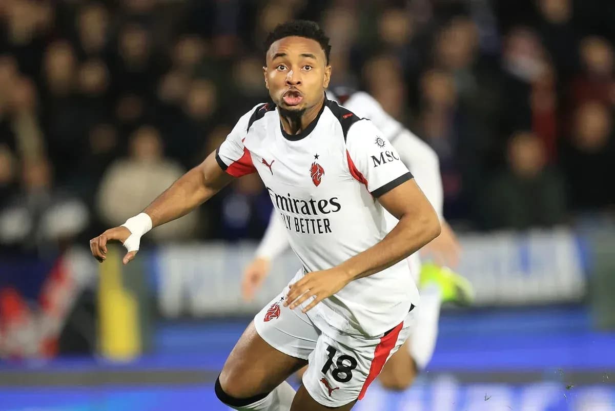 Player wearing AC Milan jersey during match action