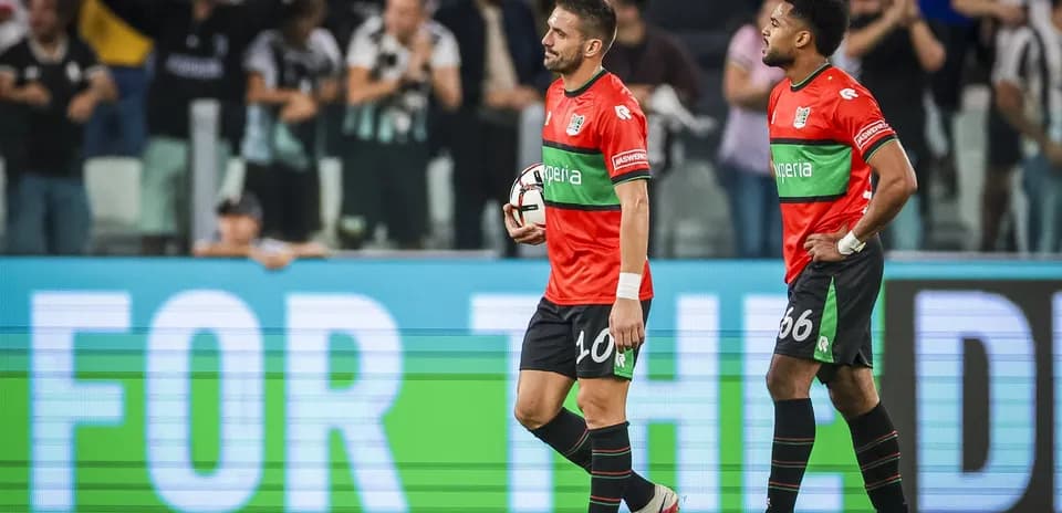 Two players walking off the field after match