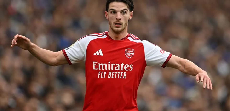 Player in Arsenal kit gesturing during match