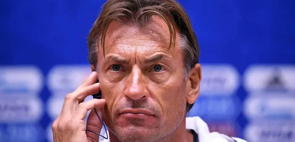 Coach speaking at press conference with earpiece