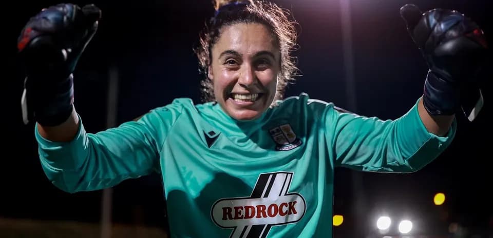 Goalkeeper celebrating during night match