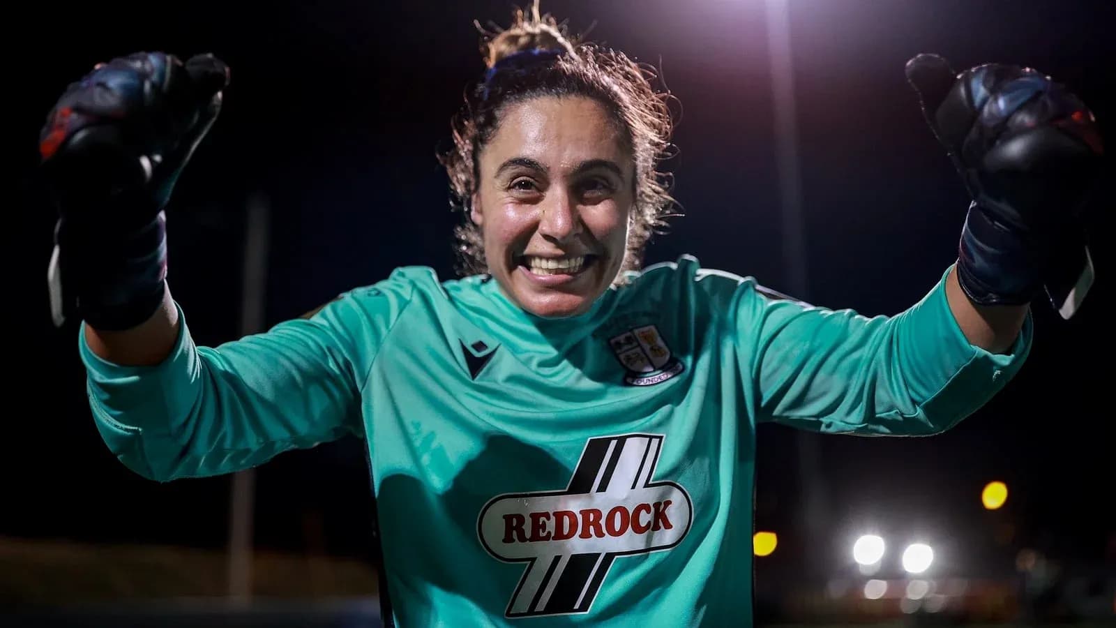 Goalkeeper celebrating during night match