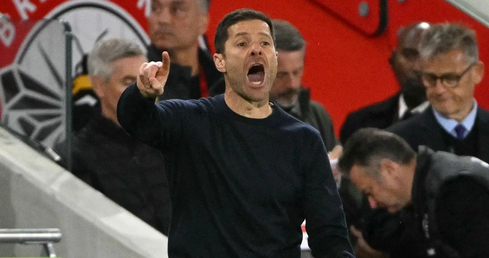 Coach giving instructions from the sidelines during match
