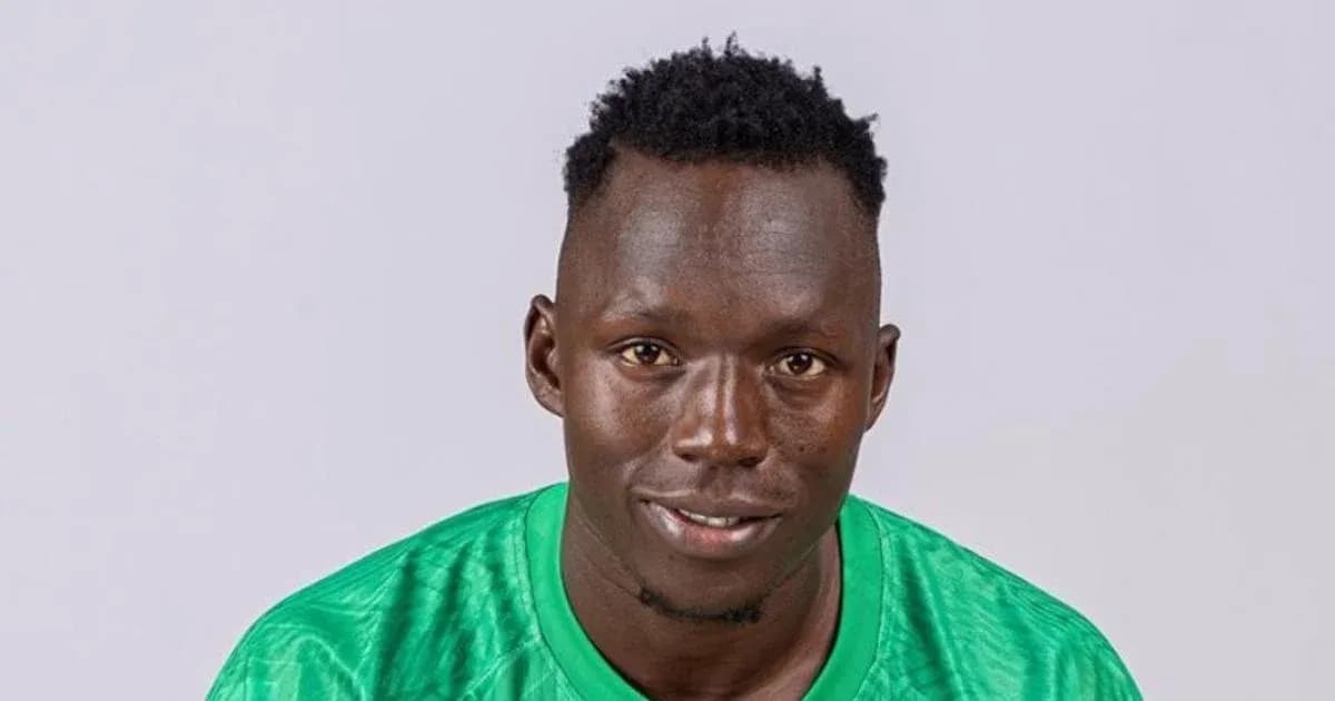 Goalkeeper posing in green kit for portrait