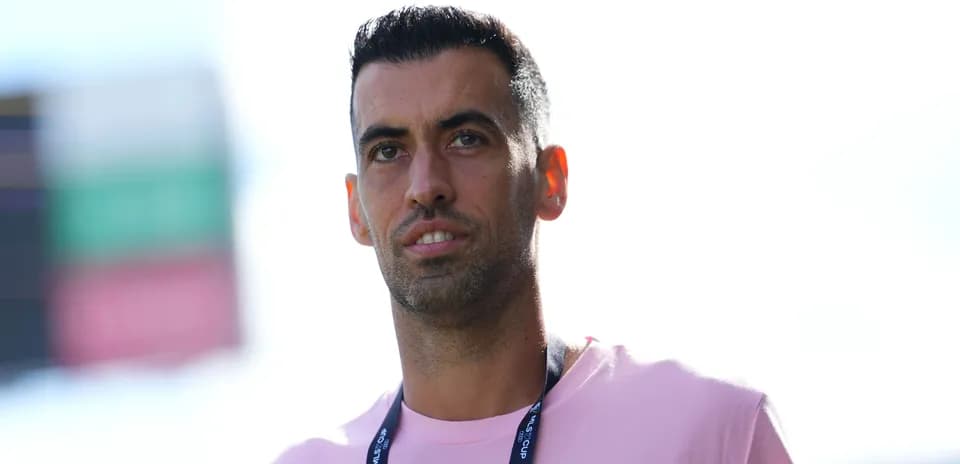 Player in a pink shirt with lanyard at event