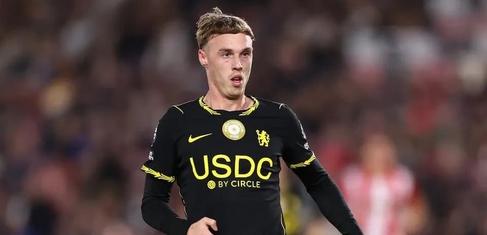Player in black jersey running on field