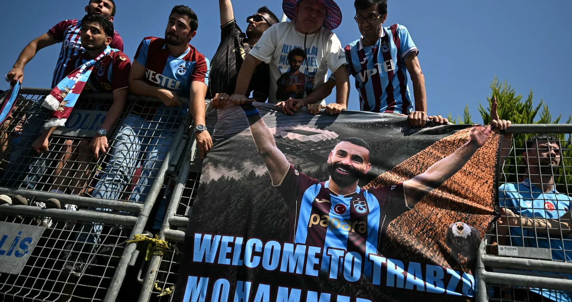 Fans holding banner welcoming player to Trabzon
