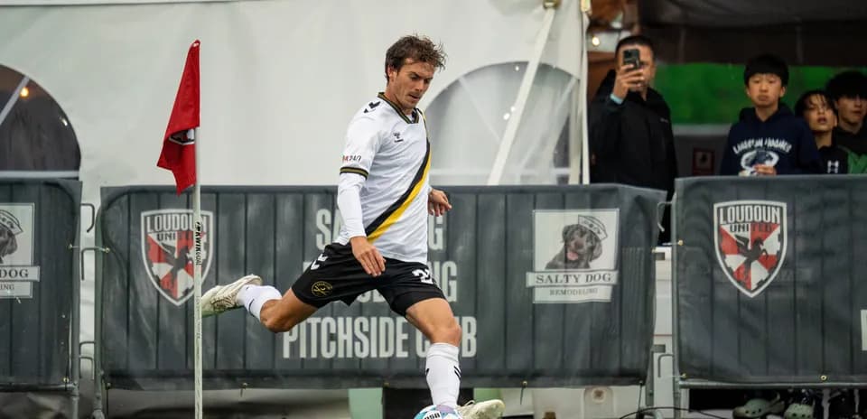 Player taking a corner kick during match