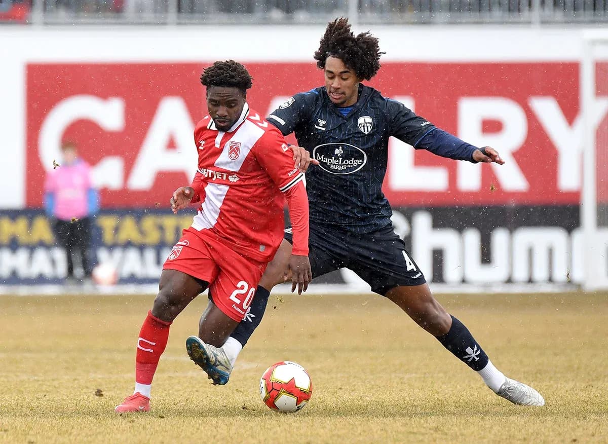 Players competing for the ball during match