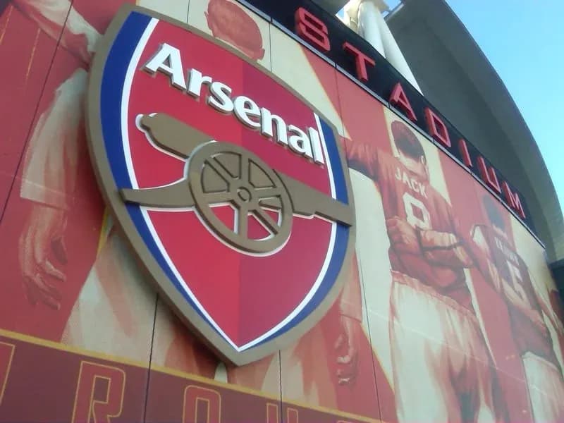 Arsenal logo displayed on stadium wall