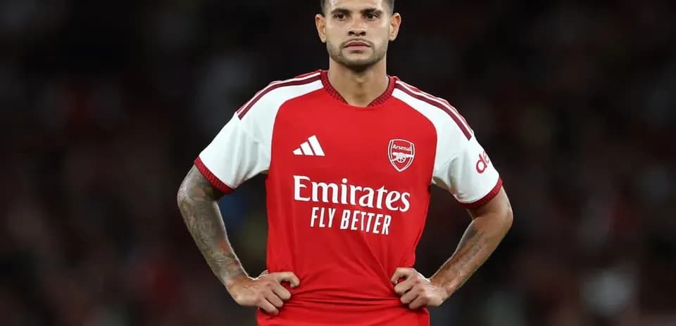 Player in Arsenal jersey standing on the field