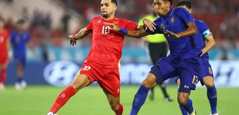 Players from opposing teams contesting for the ball