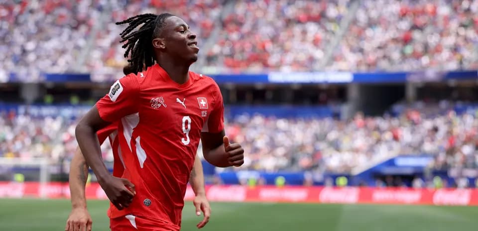 Player in red jersey celebrating during match