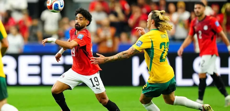 Player from Egypt and Australia competing for the ball