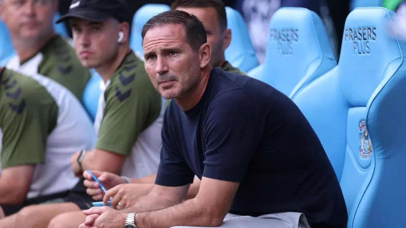 Coach seated on the bench during a match