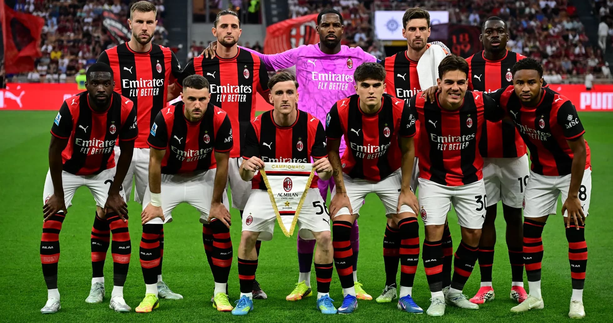 AC Milan team posing with championship banner