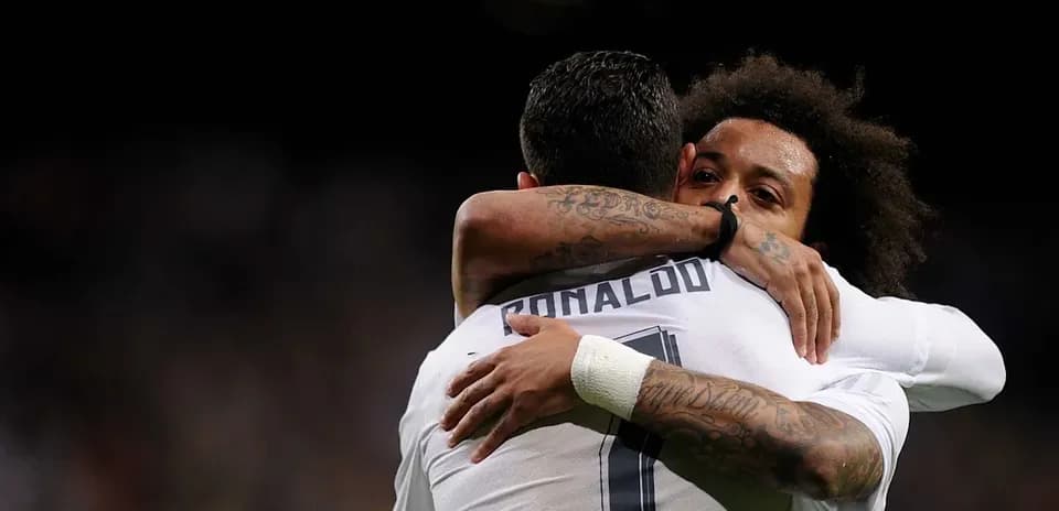Cristiano Ronaldo and Marcelo embracing after a goal