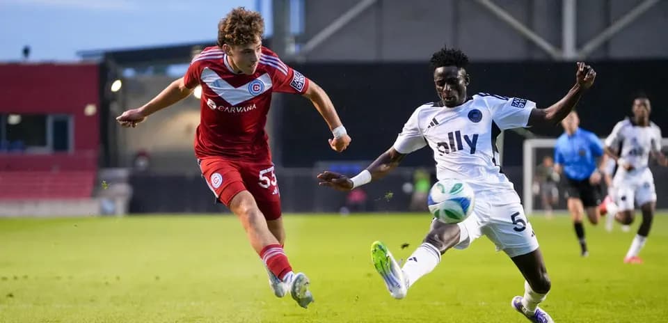 Crown Legacy player challenging Chicago Fire II player