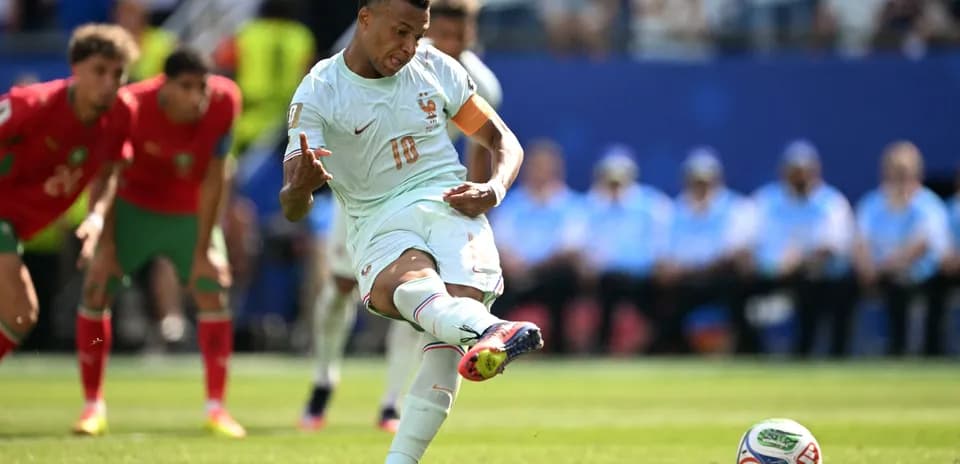 Player taking a penalty kick during match