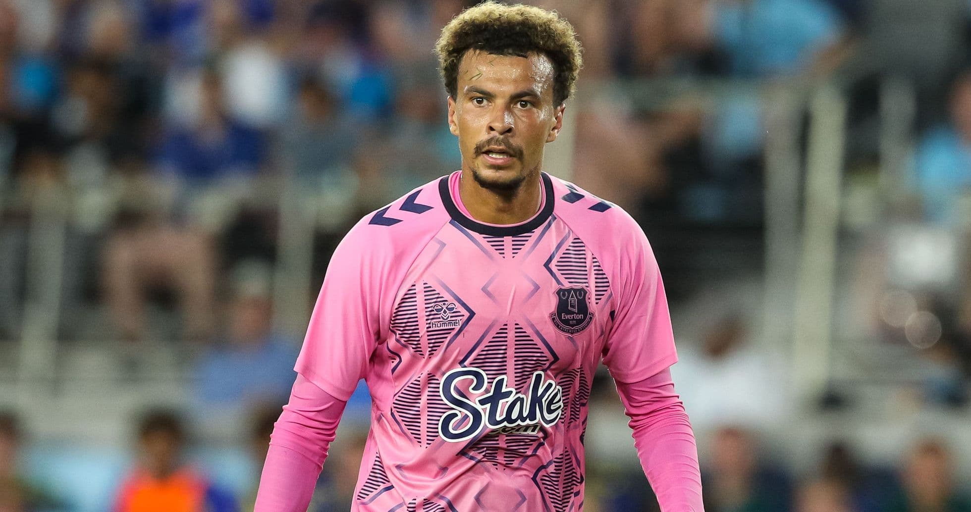 Goalkeeper in pink jersey during match action
