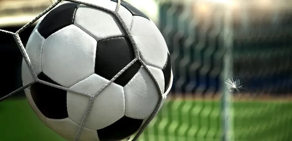 Soccer ball in net at a stadium