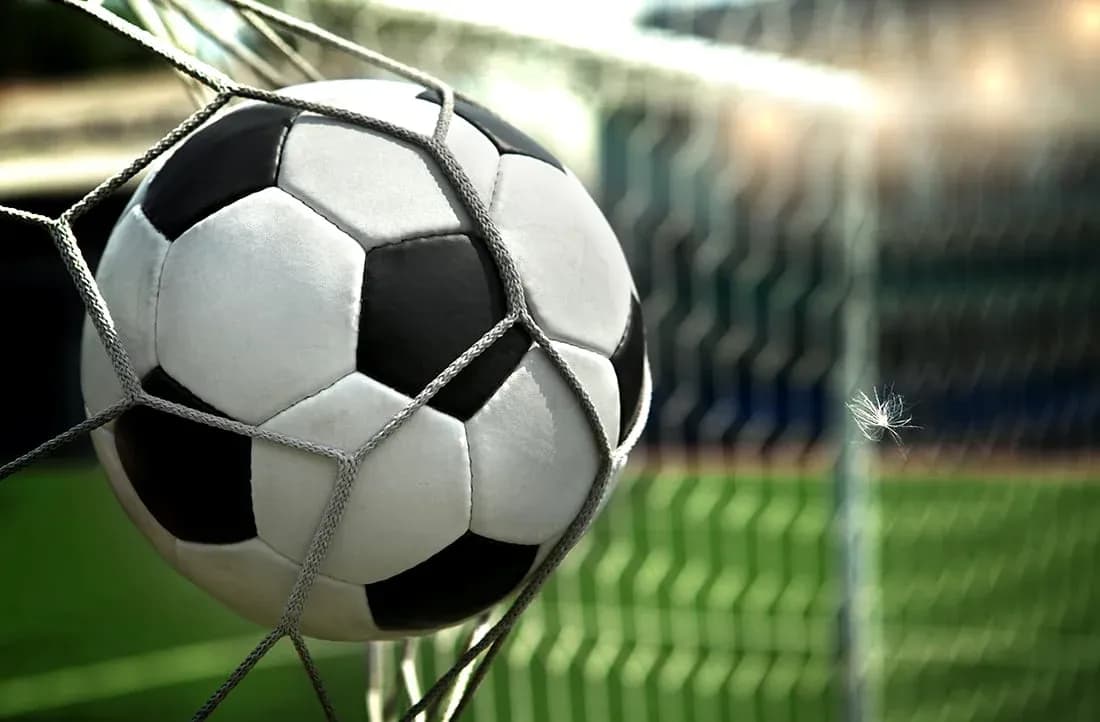 Soccer ball in net at a stadium
