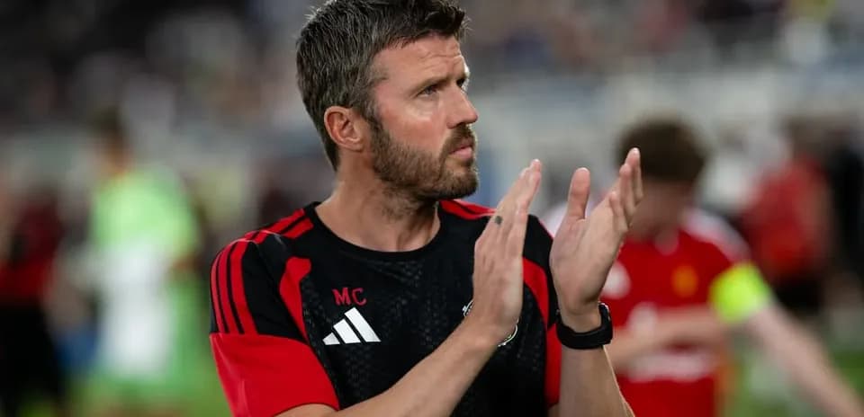 Coach clapping during warm-up before the match