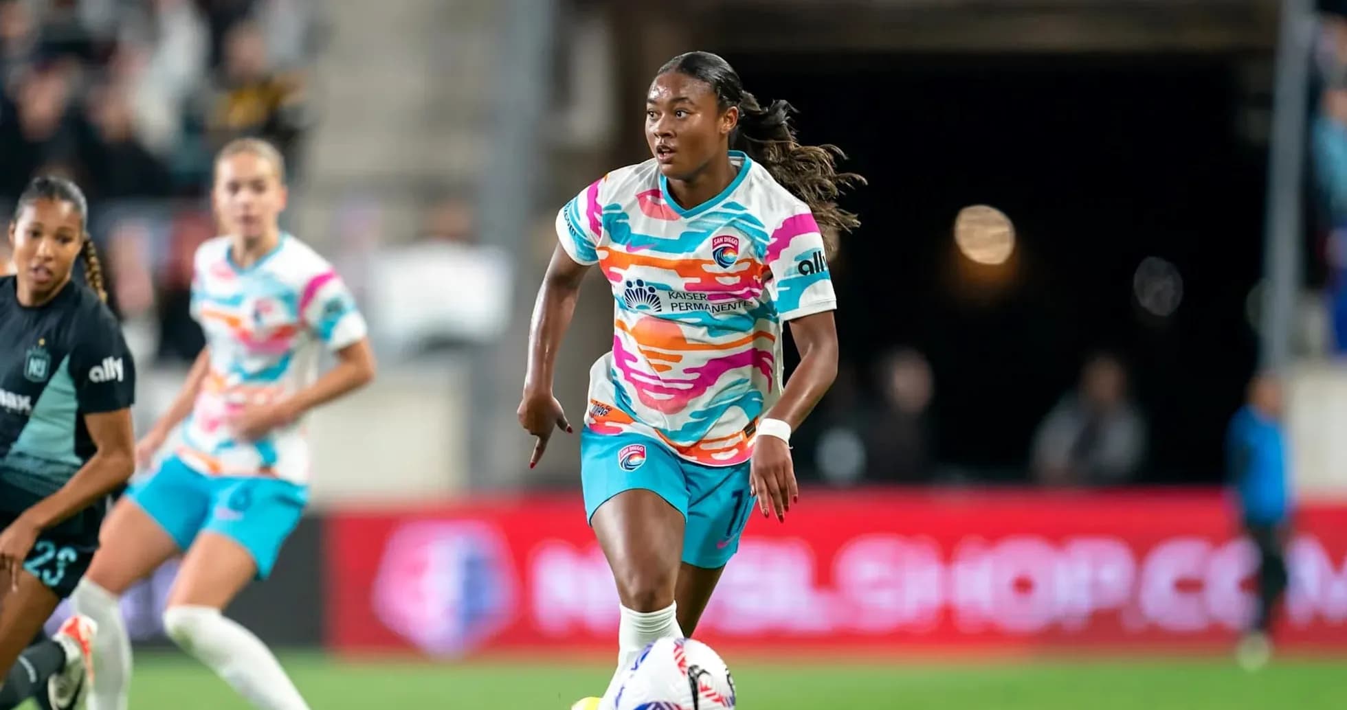 San Diego Wave player dribbling during match